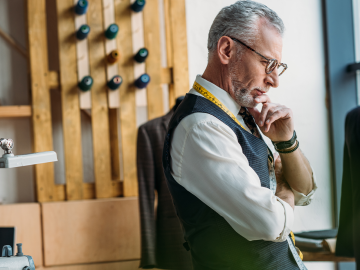 Male tailor looking pensive