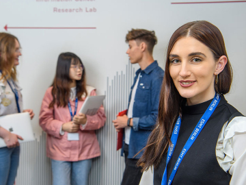female student at the forefront of image with three students in the background
