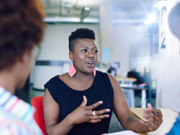 Black woman talking at meeting