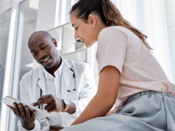A doctor shares information with a patient
