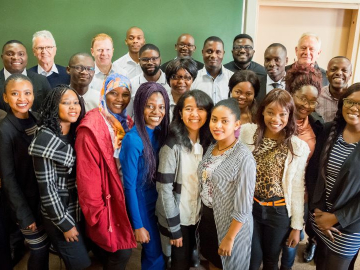 African students posing for group photo with professors