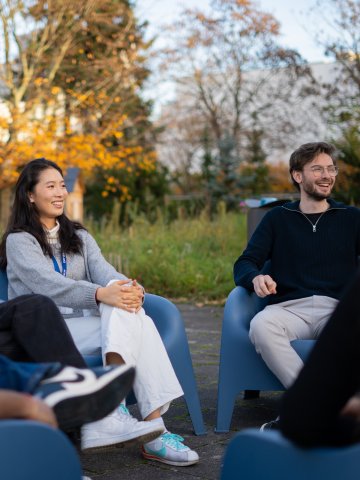 ESMT Berlin Master's students relax in the campus garden