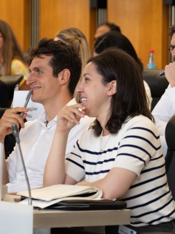 ESMT Berlin Global Online MBA students having a light moment in class and laughing together