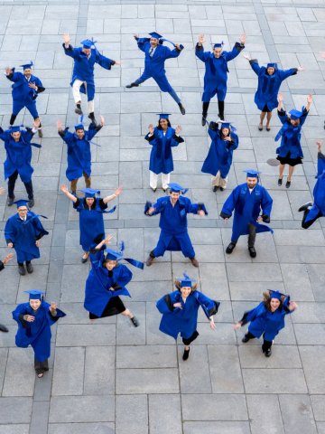 The ESMT Full-time MBA Class of 2026 jumping for joy after graduation