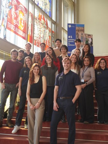 ESMT Consultancy Club posing on the staircase at ESMT as a group