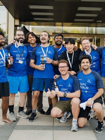 ESMT Berlin Full-time MBA student Scott Davis and team members from his cohort showing their medals from the ESMT Olympics