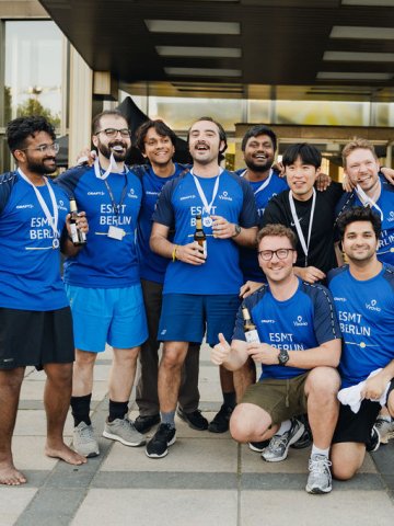 ESMT Berlin Full-time MBA student Scott Davis and team members from his cohort showing their medals from the ESMT Olympics