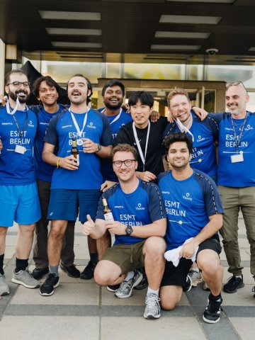 ESMT Berlin Full-time MBA student Scott Davis and team members from his cohort showing their medals from the ESMT Olympics