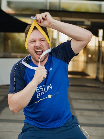 ESMT Berlin Full-time MBA student Scott Davis with his medals at the ESMT Olympics