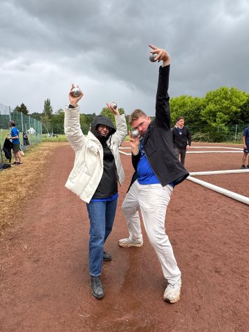 ESMT Berlin Full-time MBA student Scott Davis and teammate celebrating at MBAT