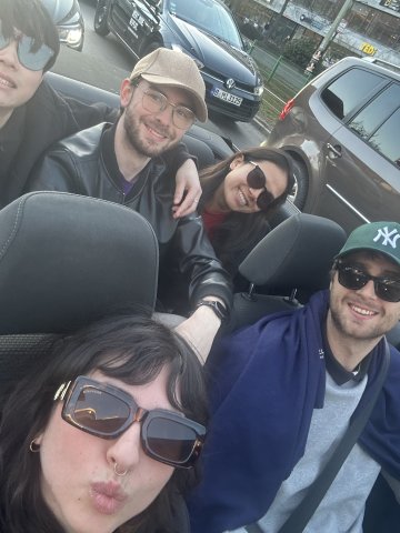 The ESMT Berlin Master in Innovation and Entrepreneurship student Valentina Vergara Stange and classmates riding through Berlin in a convertible