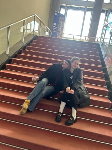 Master in Innovation and Entrepreneurship student Valentina Vergara Stange and a friend sitting on the grand staircase at ESMT
