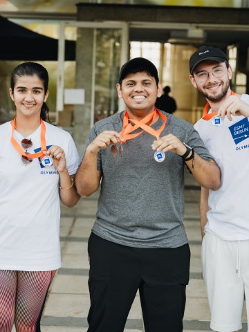 ESMT Berlin Master's student posing with their medals at the campus olympics