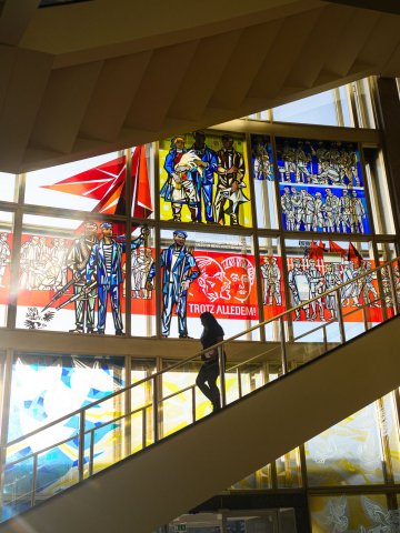 Staircase and stained-glass windows inside ESMT Berlin's historic campus in the former Staatsratsgebäude.