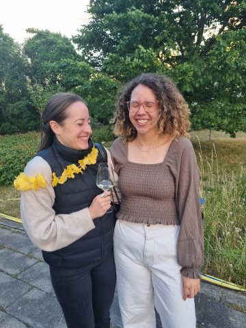 ESMT Berlin Full-time MBA student Beatriz Sgobi laughing with a classmate