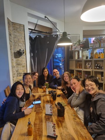 ESMT Berlin Full-time MBA student Beatriz Sgobi and her cohort at a class dinner