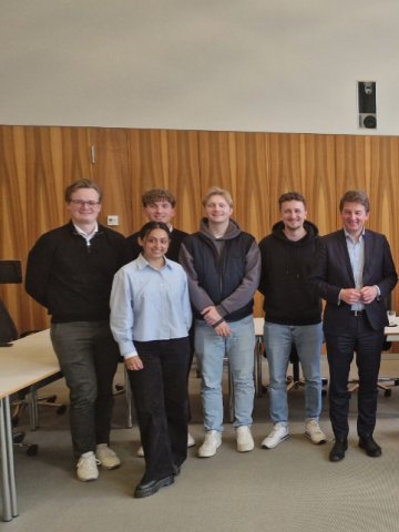 ESMT Berlin Master in Analytics and AI  students in a classroom campus with the school's president