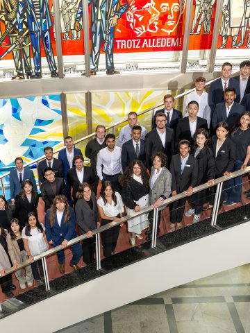 Portrait of ESMT Berlin Master in Analytics and AI  class of 2026 standing on the main campus staircase