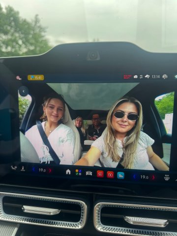 Master in Global Management student Johanna Shulze Thier and coworkers driving a Mercedes-Benz during her internship with Mercedes-Benz group AG