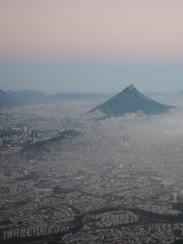 View of a misty sunrise over a city in Mexico. Photo from ESMT Berlin master's student Fynn Barkhausen