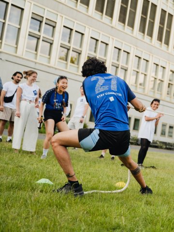 ESMT Berlin Full-time MBA students Ting Han cheering on the Tug of War at the ESMT Olympics