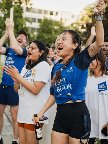 Full-time MBA students Ting Han and Roshni Dutta cheering in the garden during the ESMT school olympics