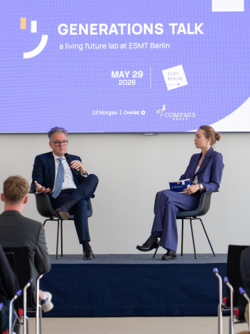 Master's student Sophie von Rohr and Alexander Mayer, Head of Germany & Austria at J.P. Morgan, on stage in front of audience during the Generations Talk event at ESMT Berlin