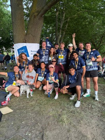 ESMT Berlin students posing during a relay race with the school running club