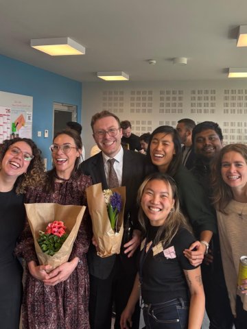 ESMT Berlin Full-time MBA students celebrating a classmate's birthday in the student lounge on campus