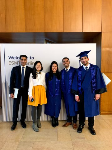 ESMT Berlin Full-time MBA alum Animesh Srivastav and classmates on graduation day in caps and gowns 