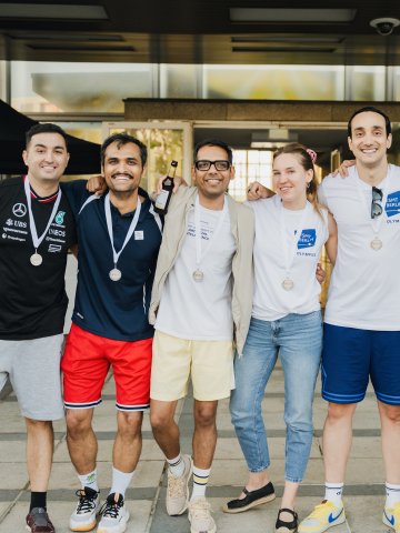 ESMT Berlin MBA students and alumni celebrating together after winning a medal at the ESMT Olympics