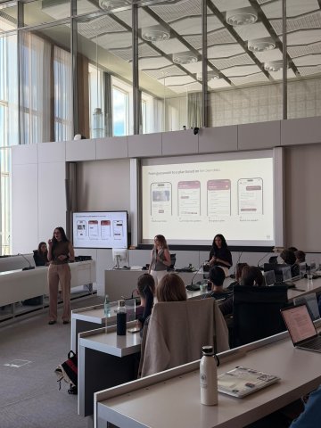 ESMT Berlin Master in Innovation and Entrepreneurship students Jasmin Mantwill, Laura Ruiz, and Gwyneth-Tyger Carys Neumann presenting their business idea to their cohort