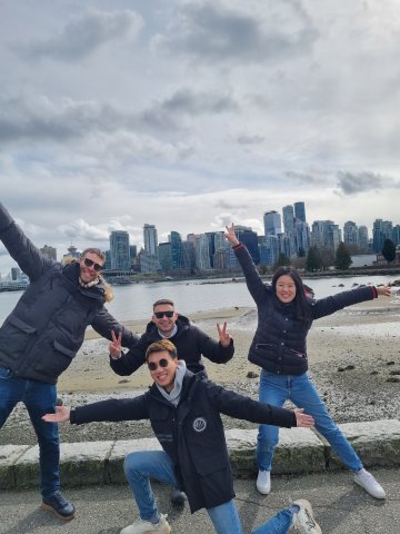 ESMT Berlin Part-time MBA student Pavel Seraphimov and classmates on the shoreline during an exchange trip to Vancouver