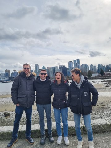 ESMT Berlin Part-time MBA student Pavel Seraphimov and classmates on the shoreline during an exchange trip to Vancouver