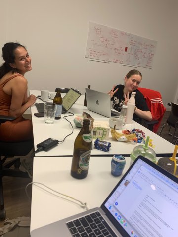ESMT Berlin Master in Innovation and Entrepreneurship students Jasmin Mantwill, Laura Ruiz, and Gwyneth-Tyger Carys Neumann brainstorming in a classroom