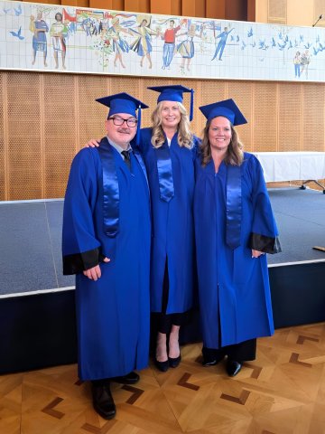 ESMT Berlin Executive MBA graduates from DHL in their mortarboards and gowns.