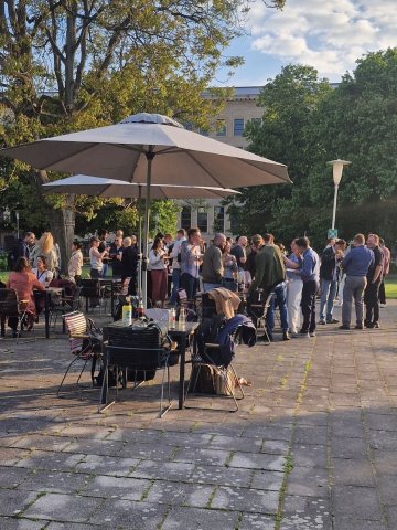 ESMT Berlin Part-time MBA students having a barbecue in the garden during a residency