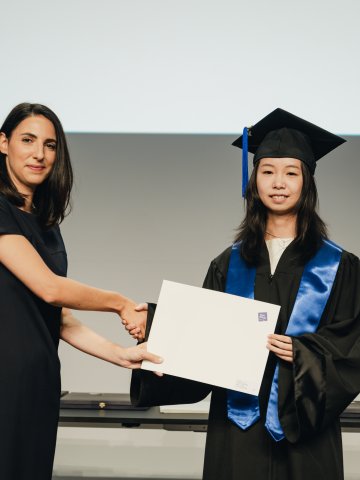 Portrait of ESMT Master in Innovation and Entrepreneurship student Yuxin Huang during her graduation ceremony