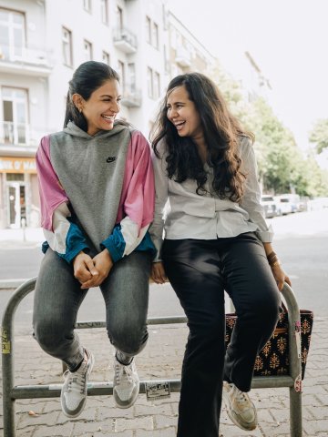 ESMT Berlin students hanging out together and laughing in central Berlin