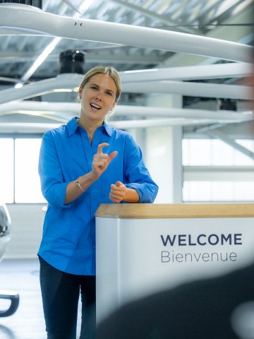 Image of ESMT Berlin Full-time MBA alum Marie Masson, doing a speech while on the job in her role of Head of Sales and Marketing at Volocopter
