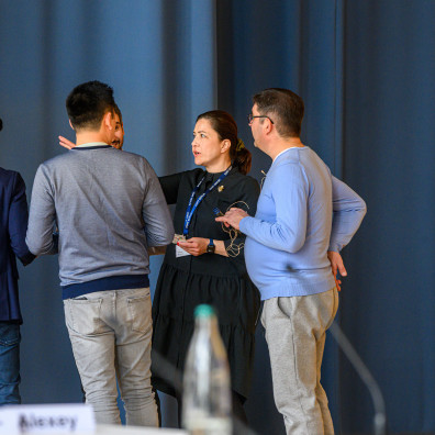 Participants in the classroom next to a flipchart