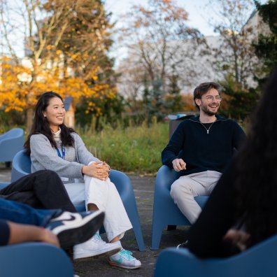 ESMT Berlin Master's students relax in the campus garden