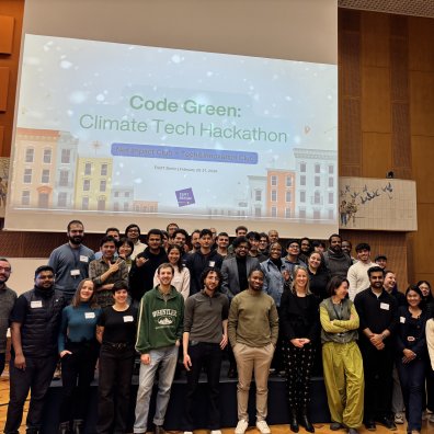 The ESMT Climate Hackathon team posing on stage