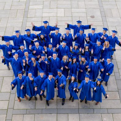 ESMT Berlin Part-time MBA graduating class, in their gowns on campus