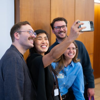 A group of MBA students taking a selfie together at the ESMT Berlin Career Fair 2026