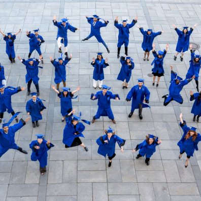 The ESMT Full-time MBA Class of 2026 jumping for joy after graduation