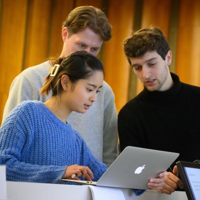 ESMT Berlin master's students intently looking at an online course together
