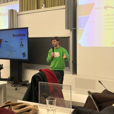 An ESMT student giving a speech at a Venture Club meeting on campus