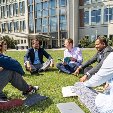 Group of ESMT EMBA students sitting in the garden