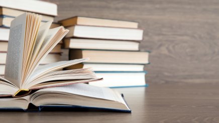 Book on wooden shelf